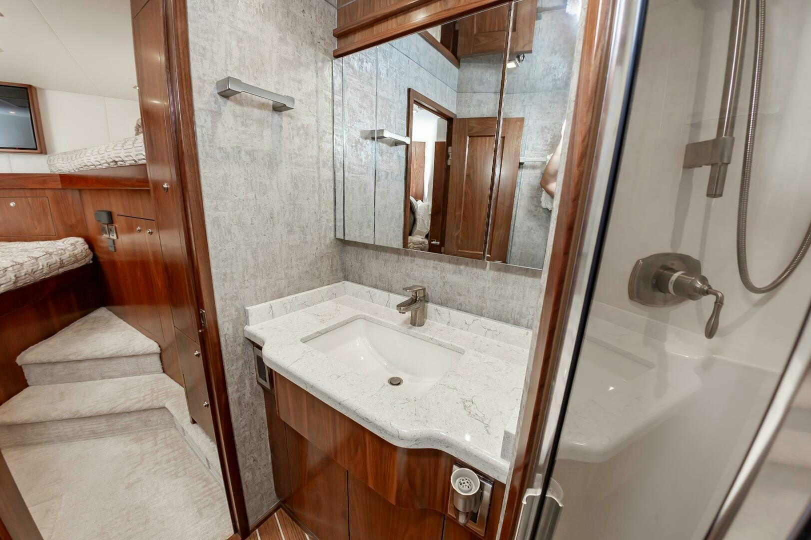 a bathroom with a sink and a mirror aboard KNOT DONE YET Yacht for Sale