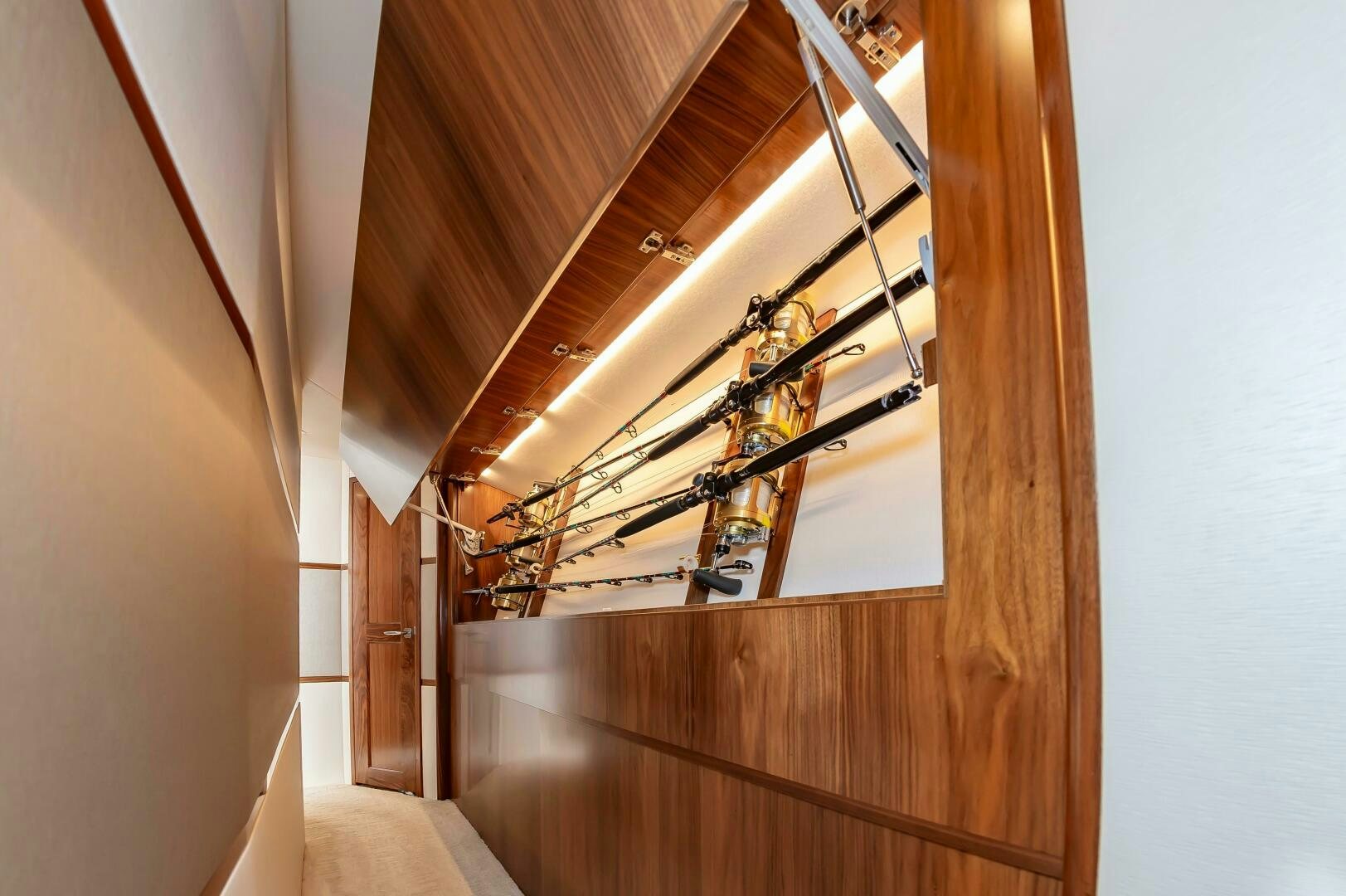 a wooden staircase with a railing aboard KNOT DONE YET Yacht for Sale