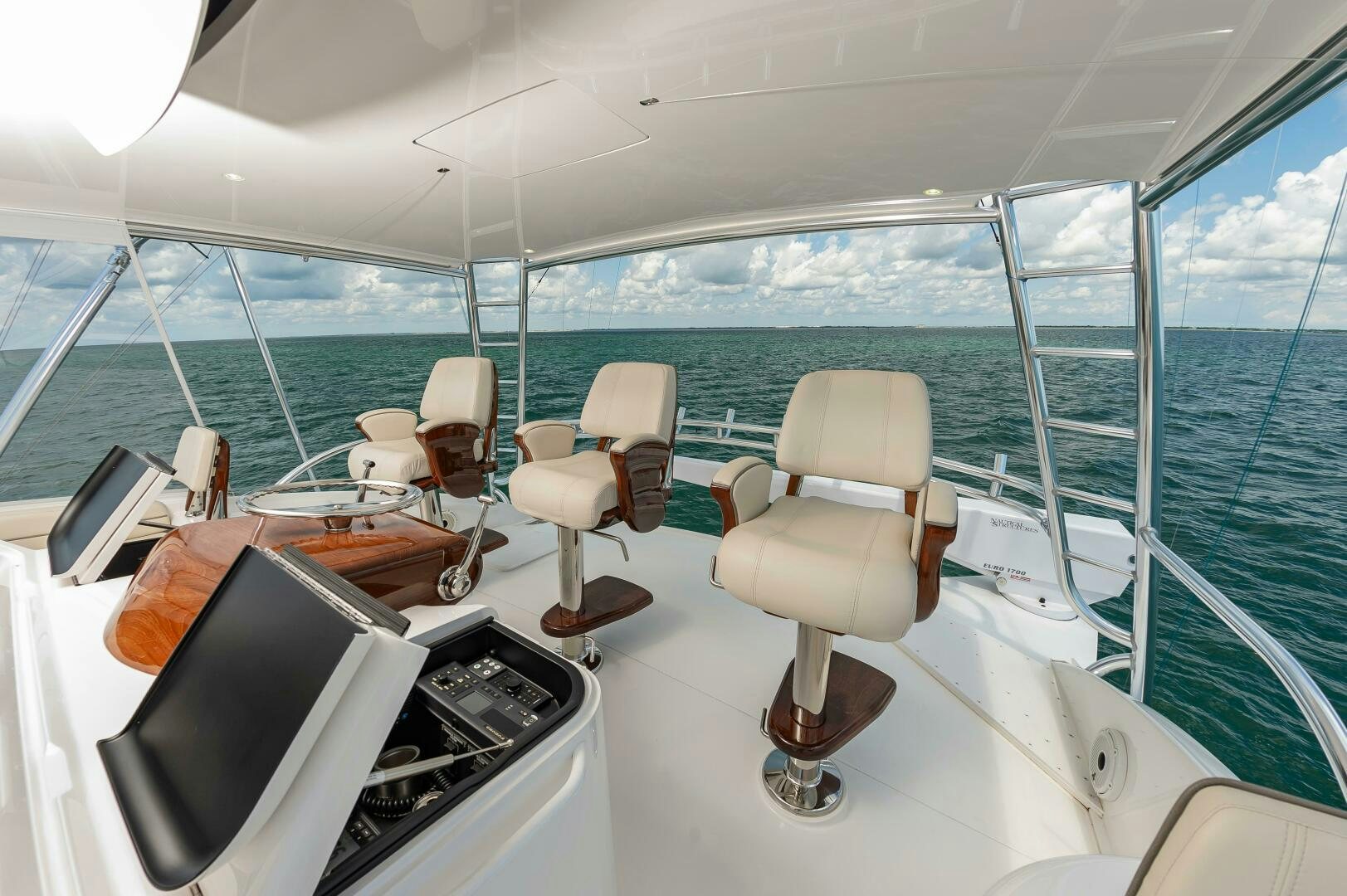 a boat with a couple of chairs aboard KNOT DONE YET Yacht for Sale