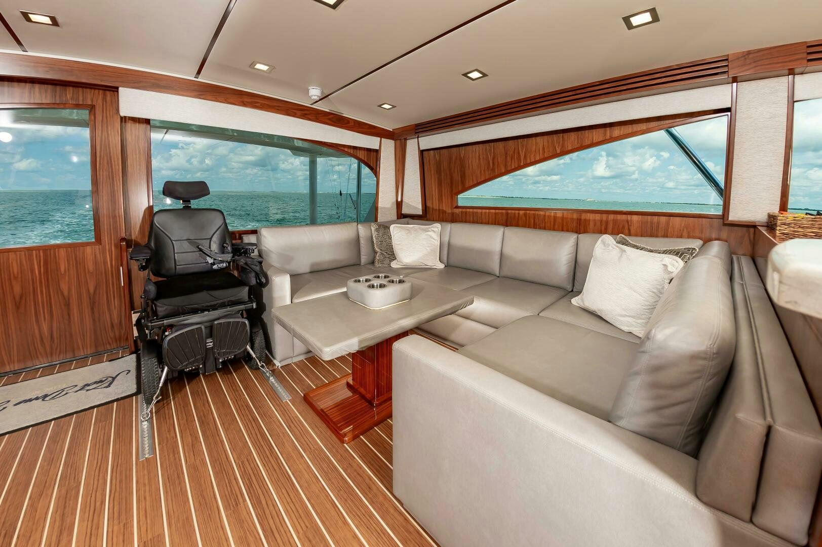 a living room with a couch and a table aboard KNOT DONE YET Yacht for Sale