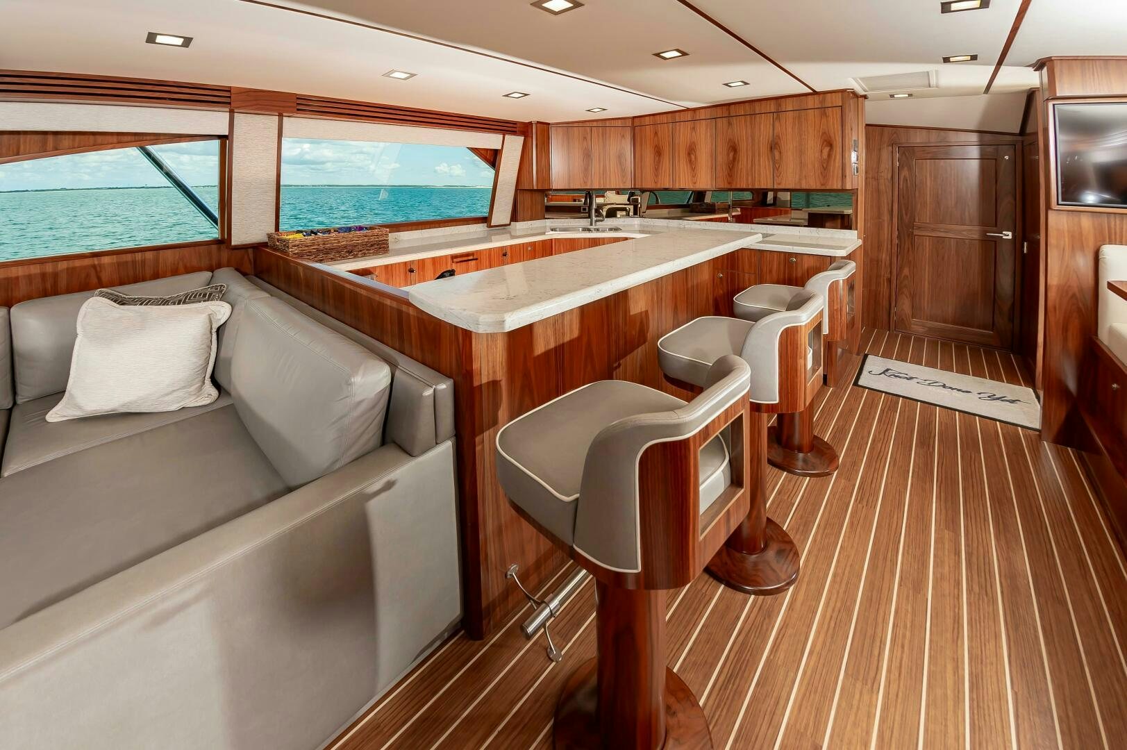 a room with a couch and a table and chairs aboard KNOT DONE YET Yacht for Sale