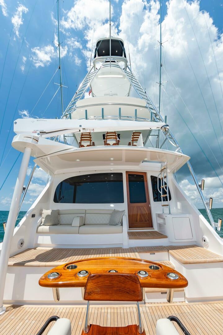 a white boat with a bench aboard KNOT DONE YET Yacht for Sale