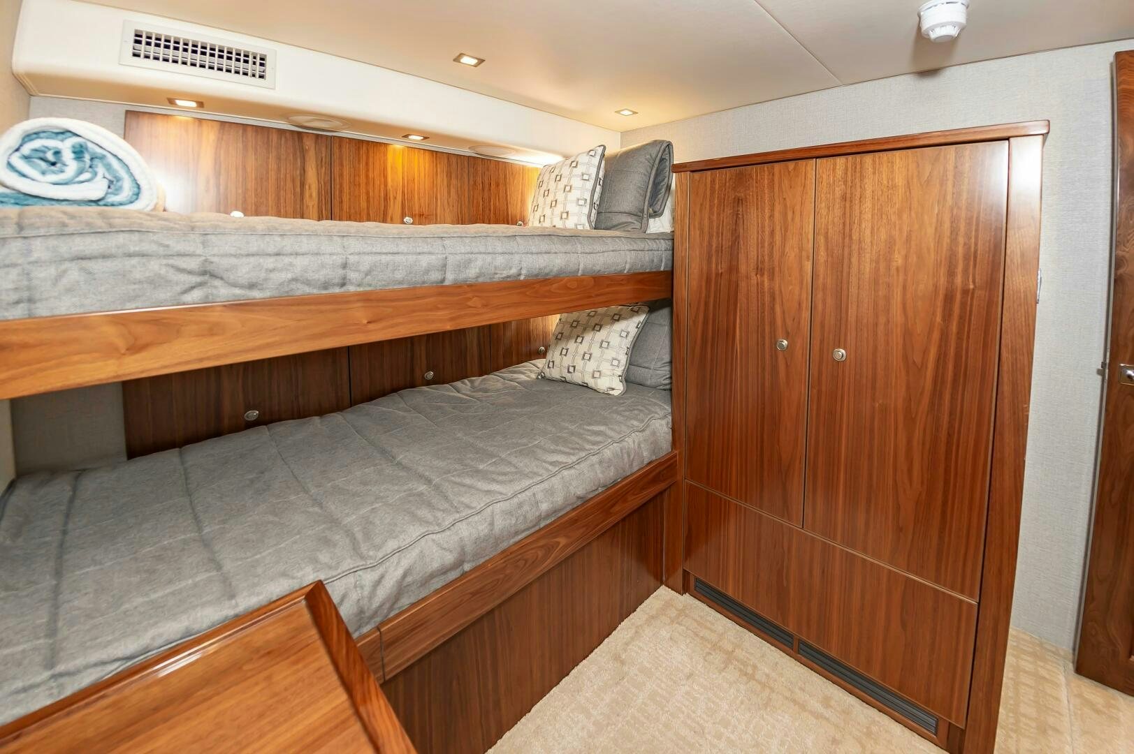 a bed with a wooden headboard aboard KNOT DONE YET Yacht for Sale