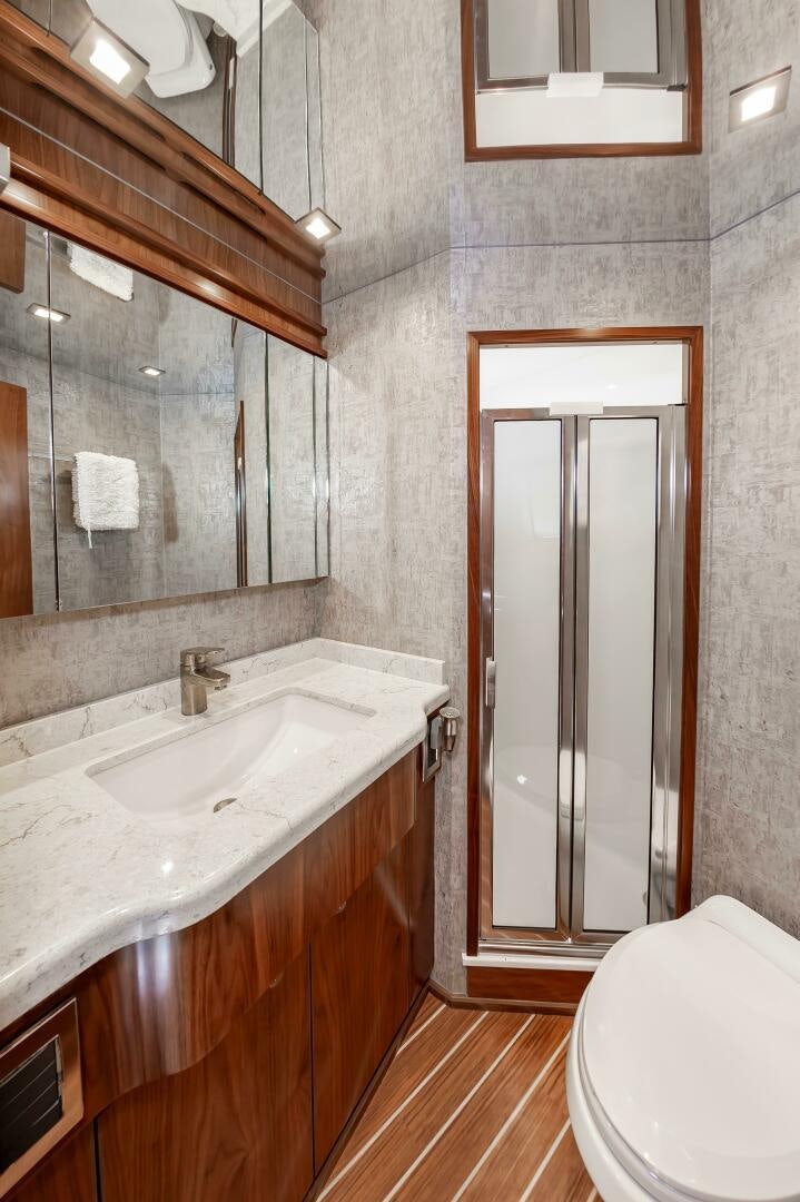 a bathroom with a sink and a toilet aboard KNOT DONE YET Yacht for Sale