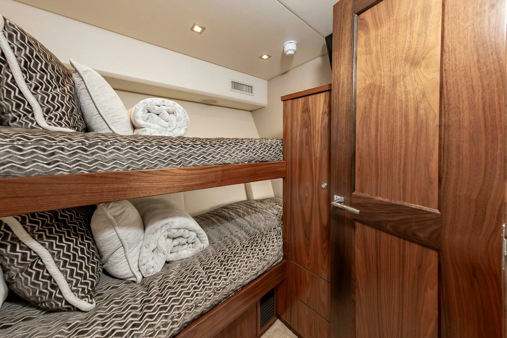 a bed with white pillows aboard KNOT DONE YET Yacht for Sale