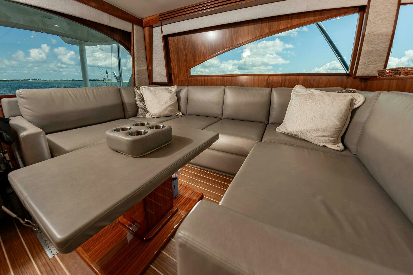 a couch and a table in a room aboard KNOT DONE YET Yacht for Sale