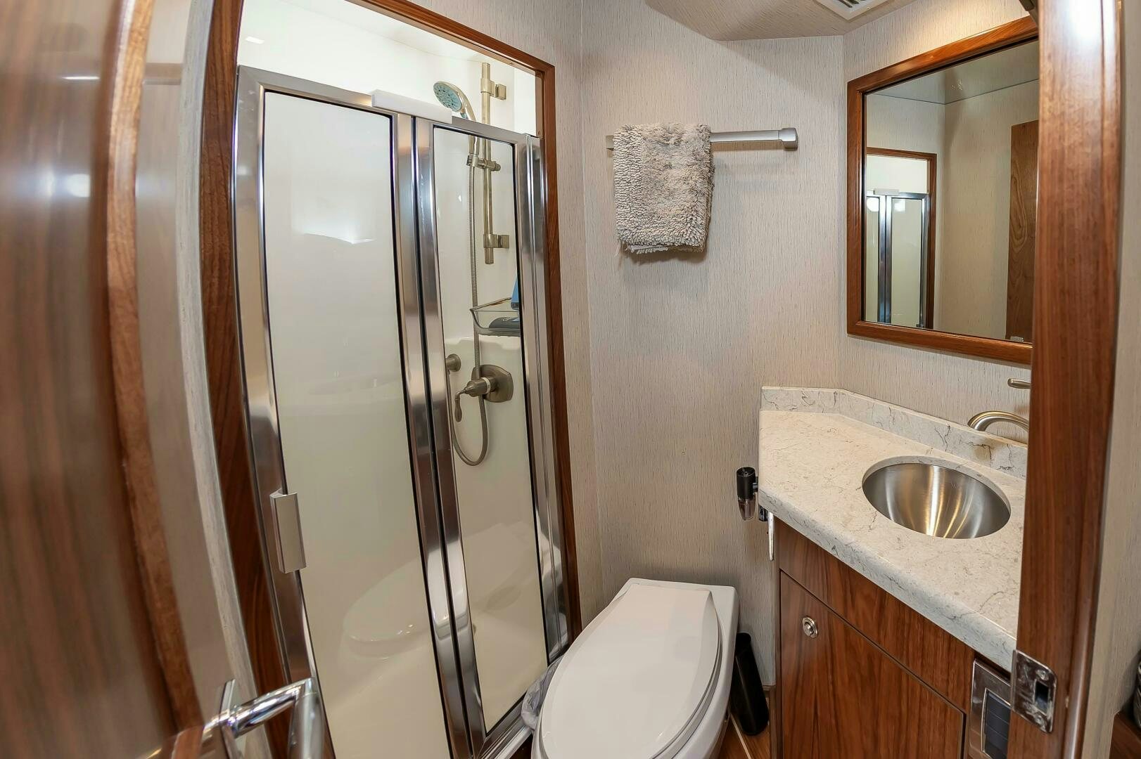 a bathroom with a glass shower aboard KNOT DONE YET Yacht for Sale
