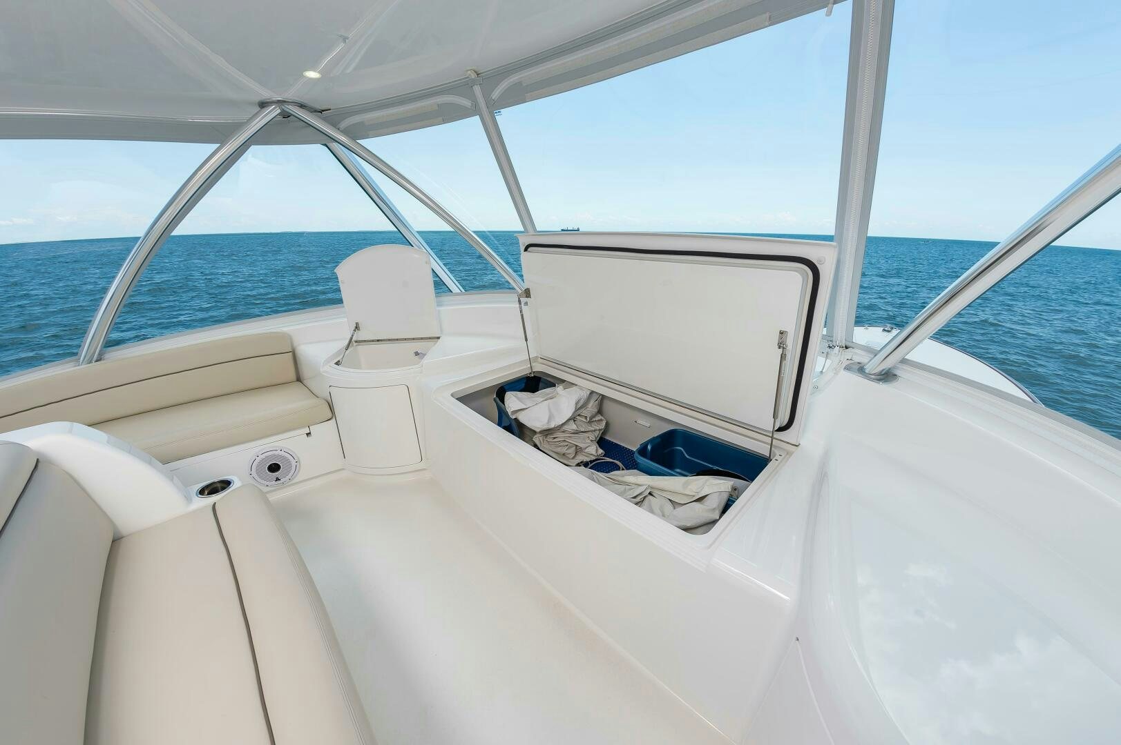 a white boat with a white cover aboard KNOT DONE YET Yacht for Sale