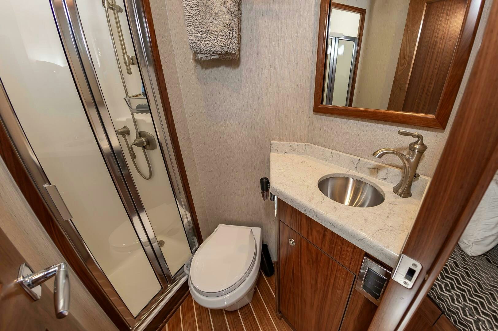a bathroom with a glass shower door aboard KNOT DONE YET Yacht for Sale