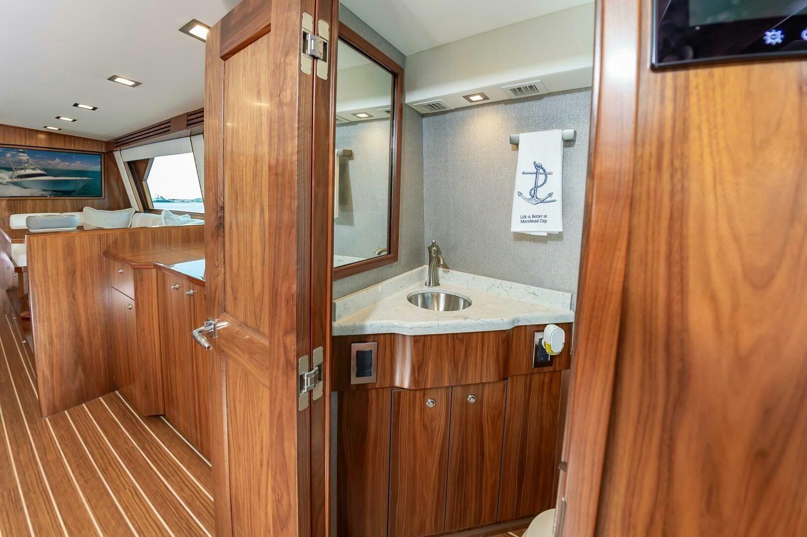 a bathroom with wooden cabinets aboard KNOT DONE YET Yacht for Sale