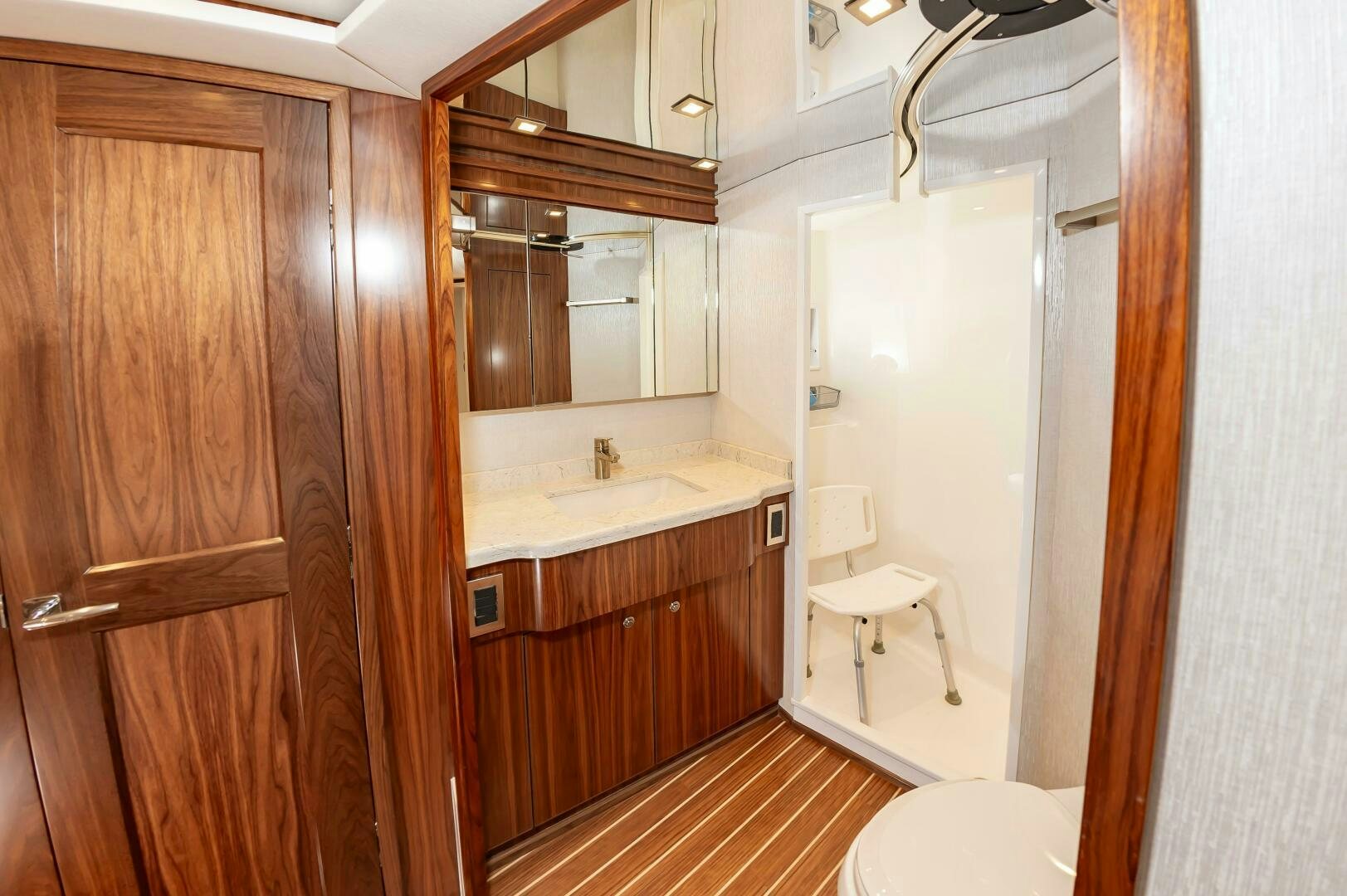 a bathroom with a sink and a mirror aboard KNOT DONE YET Yacht for Sale