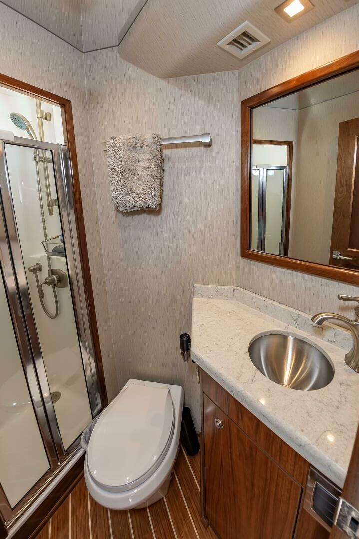a bathroom with a sink and a toilet aboard KNOT DONE YET Yacht for Sale