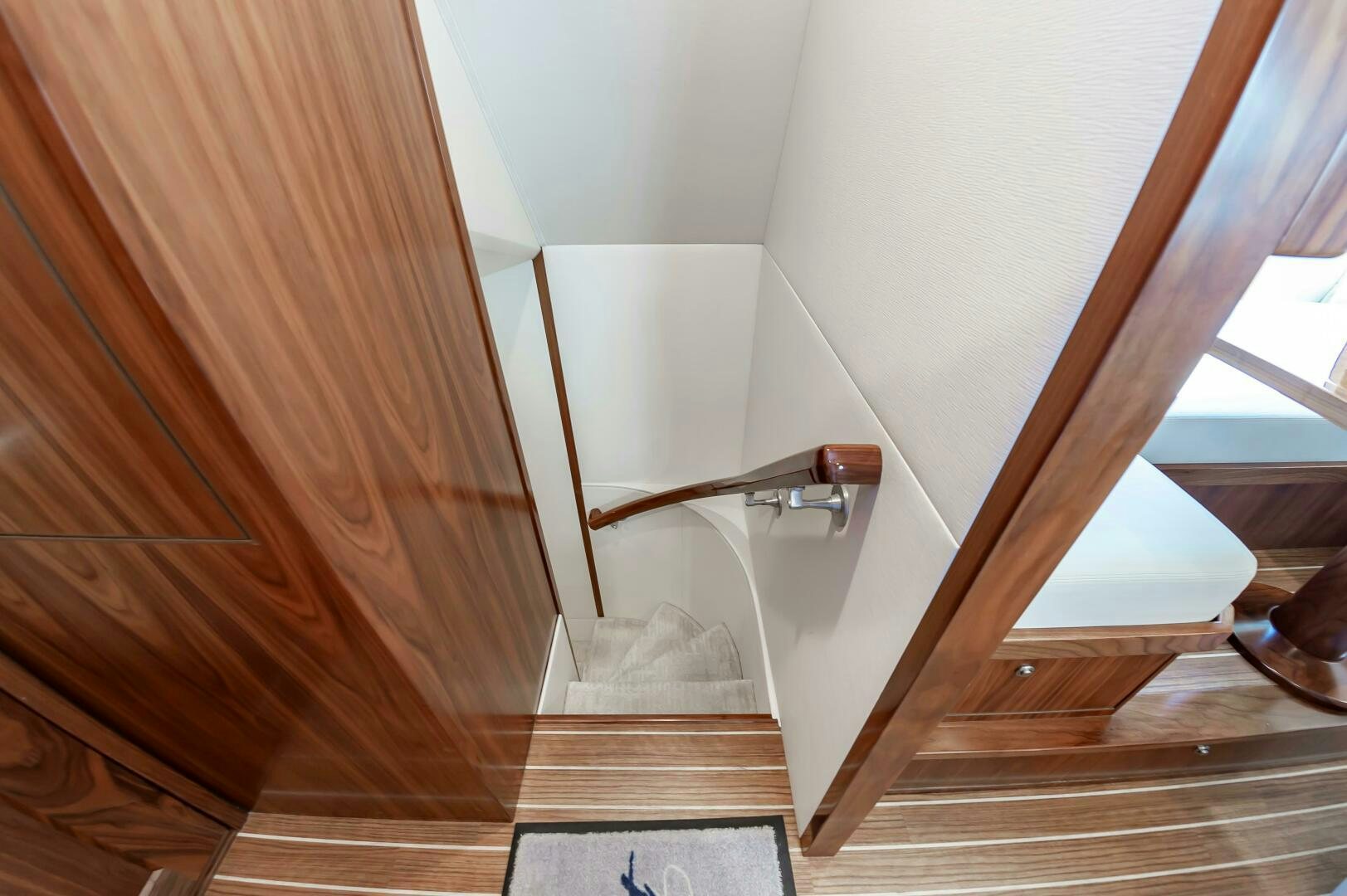a wooden staircase with a wood railing aboard KNOT DONE YET Yacht for Sale