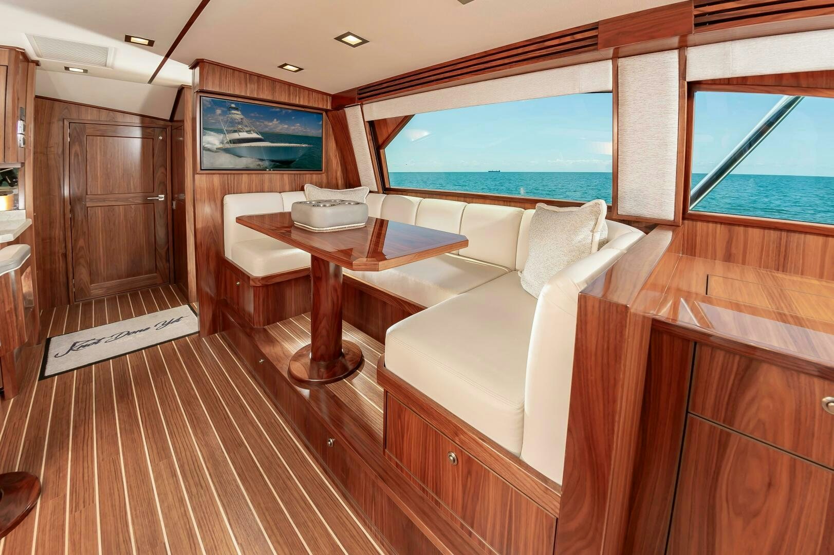 a room with a bed and a table aboard KNOT DONE YET Yacht for Sale