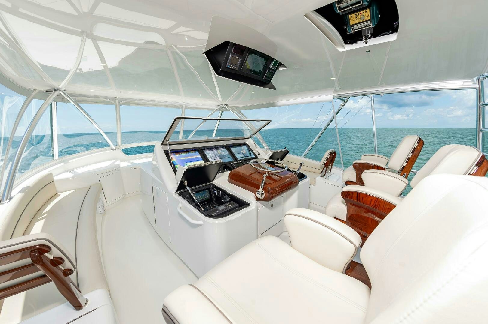 a room with a bed and a desk with a laptop on it aboard KNOT DONE YET Yacht for Sale