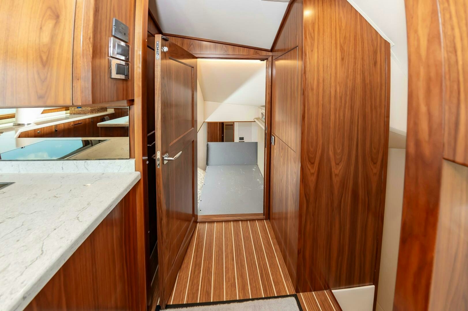 a kitchen with wooden cabinets aboard KNOT DONE YET Yacht for Sale