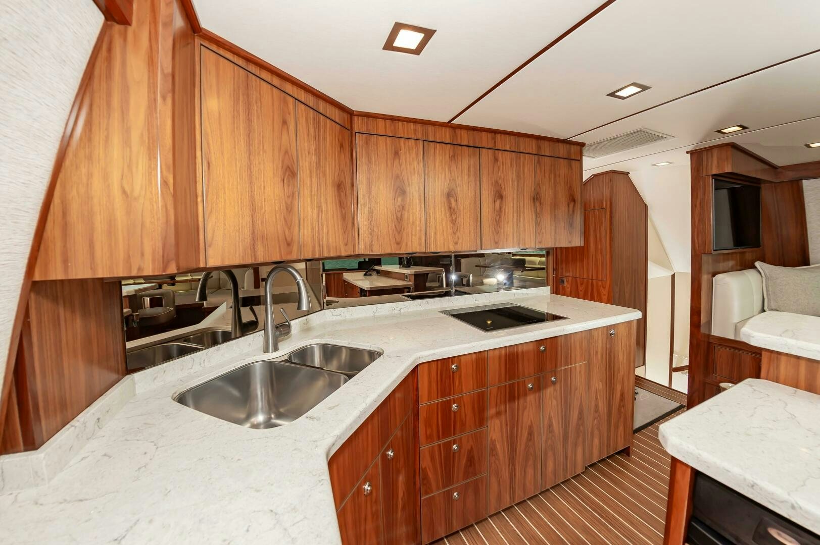a kitchen with wooden cabinets aboard KNOT DONE YET Yacht for Sale