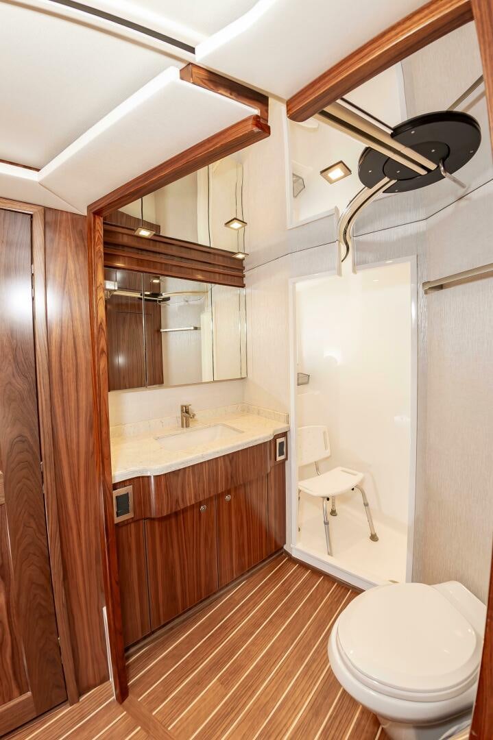 a bathroom with a toilet and sink aboard KNOT DONE YET Yacht for Sale