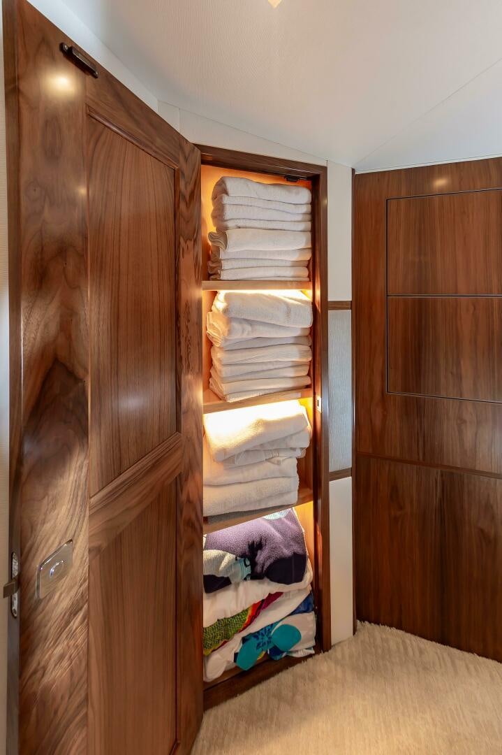 a closet with a bed and a closet aboard KNOT DONE YET Yacht for Sale