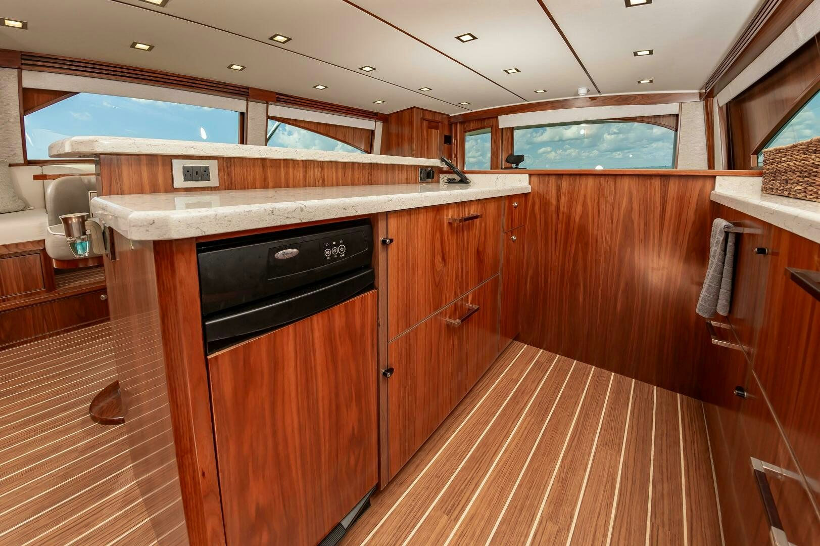 a kitchen with wooden cabinets aboard KNOT DONE YET Yacht for Sale