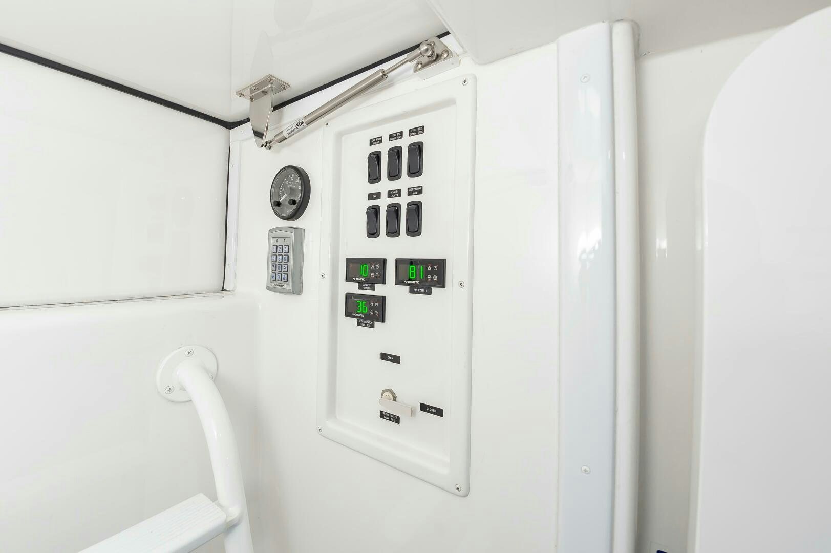 a white machine with a green screen aboard KNOT DONE YET Yacht for Sale