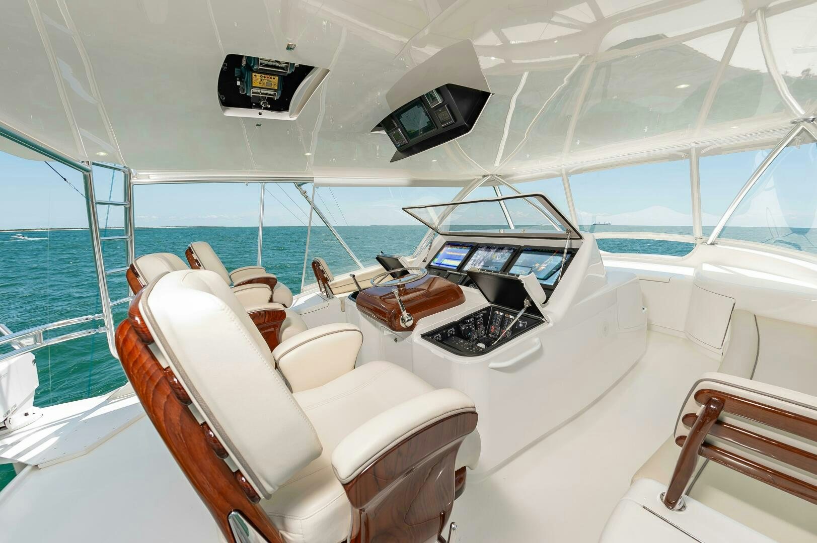 a room with a few chairs and computers on the floor aboard KNOT DONE YET Yacht for Sale