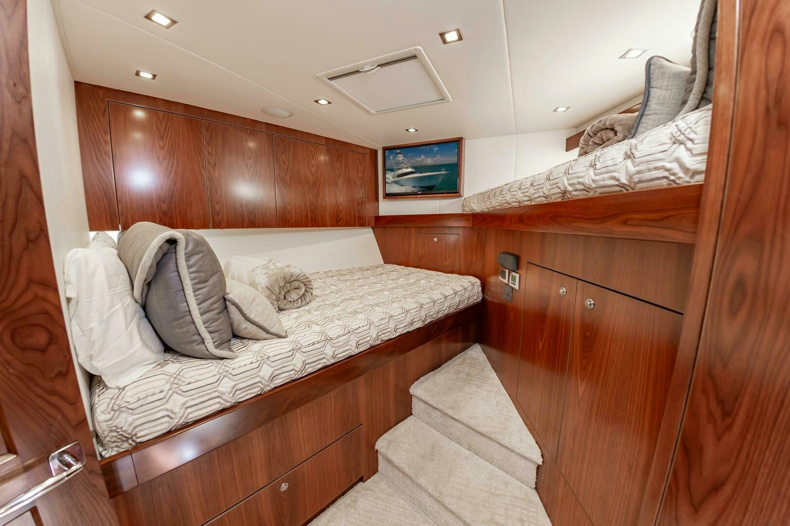 a room with wooden walls and a couple of beds aboard KNOT DONE YET Yacht for Sale