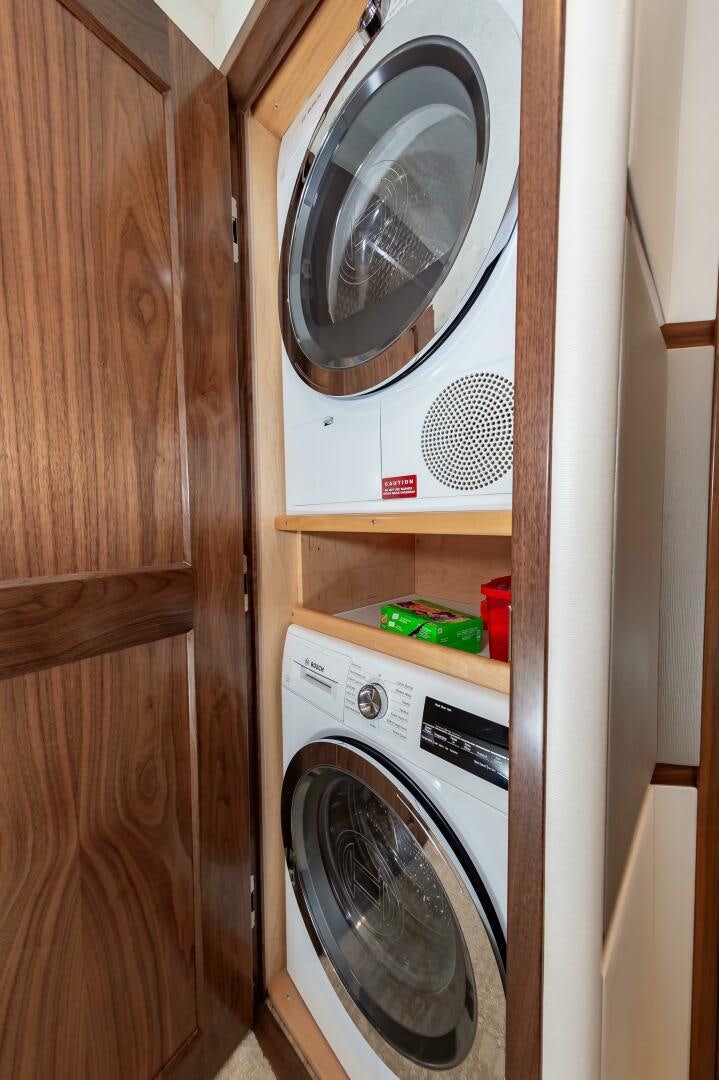 a washer and dryer in a closet aboard KNOT DONE YET Yacht for Sale