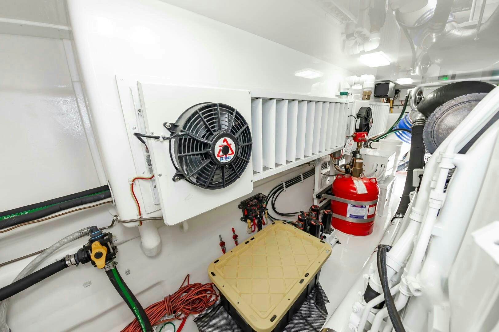 a white room with a fan and pipes aboard KNOT DONE YET Yacht for Sale