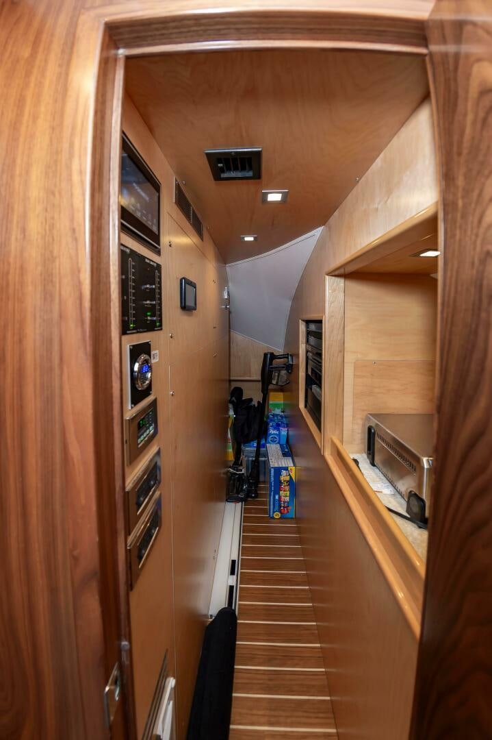 a hallway with wood walls aboard KNOT DONE YET Yacht for Sale