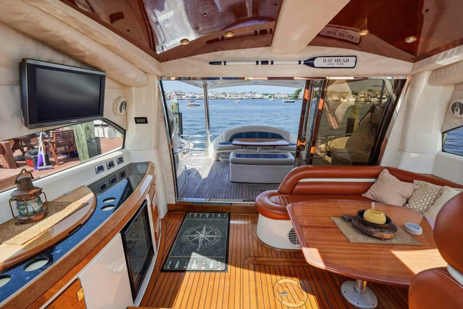 a living room with a large window aboard OBSESSION Yacht for Sale