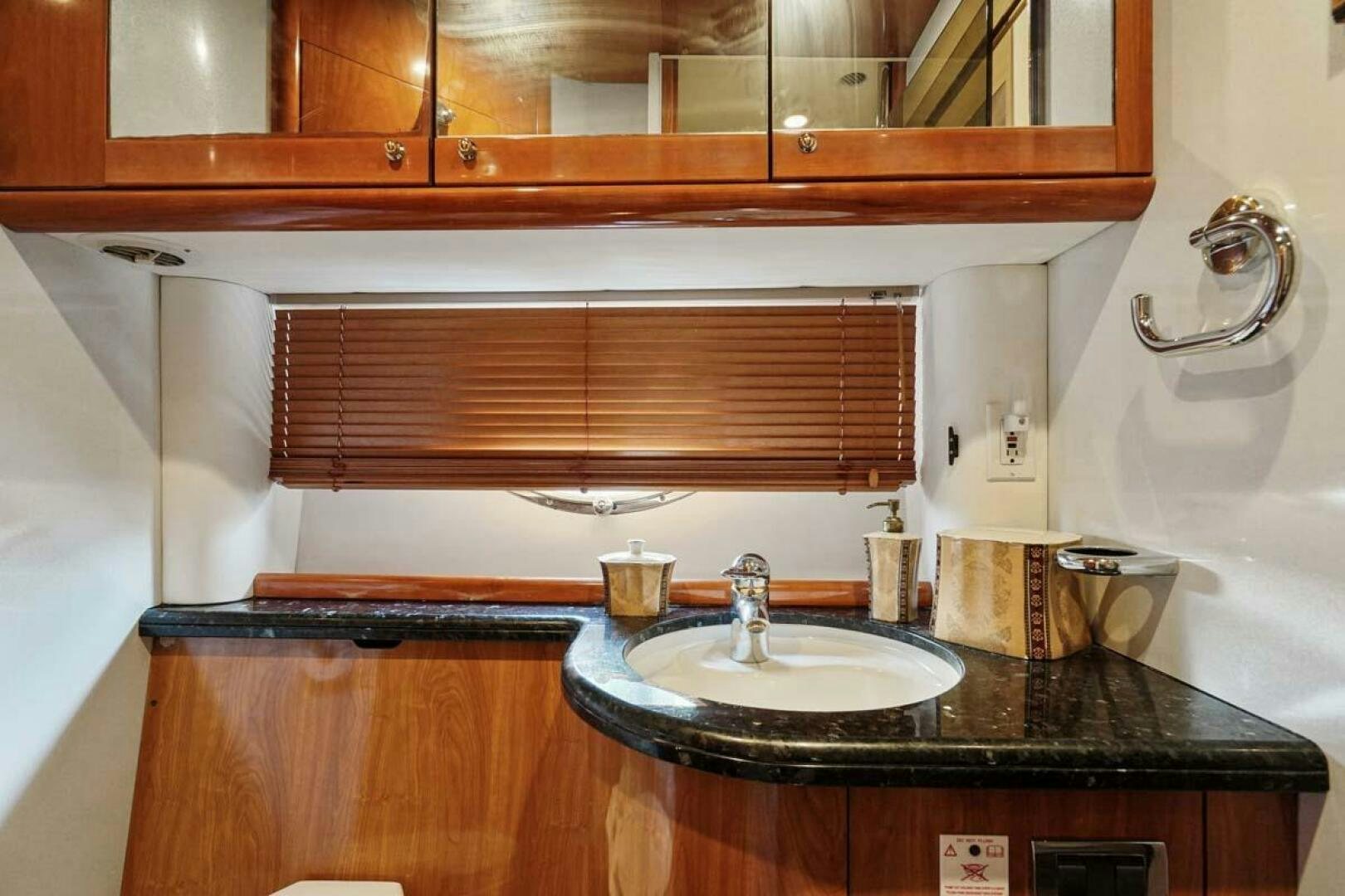 a kitchen with a sink and cabinets aboard OBSESSION Yacht for Sale