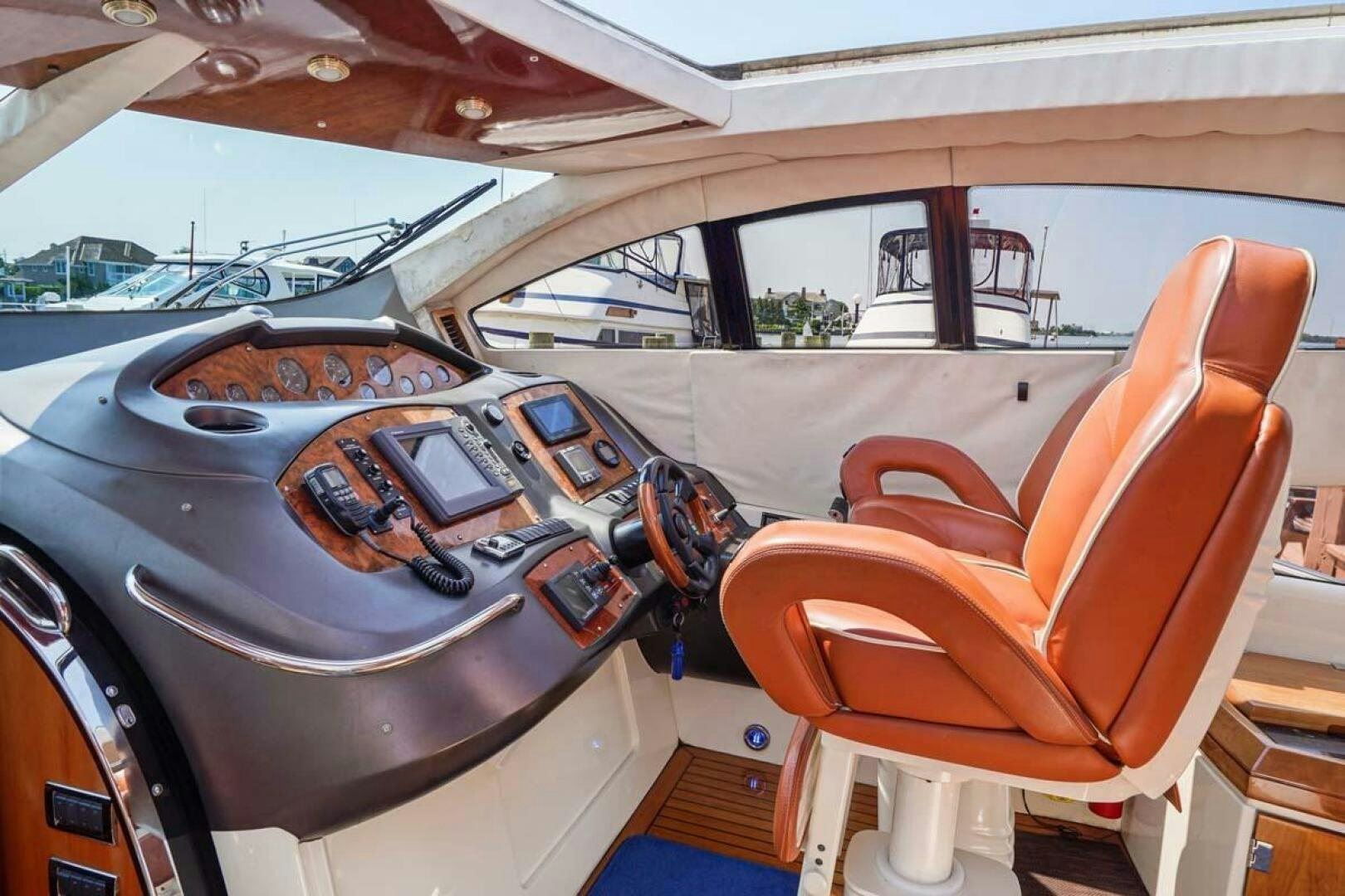the inside of a car aboard OBSESSION Yacht for Sale