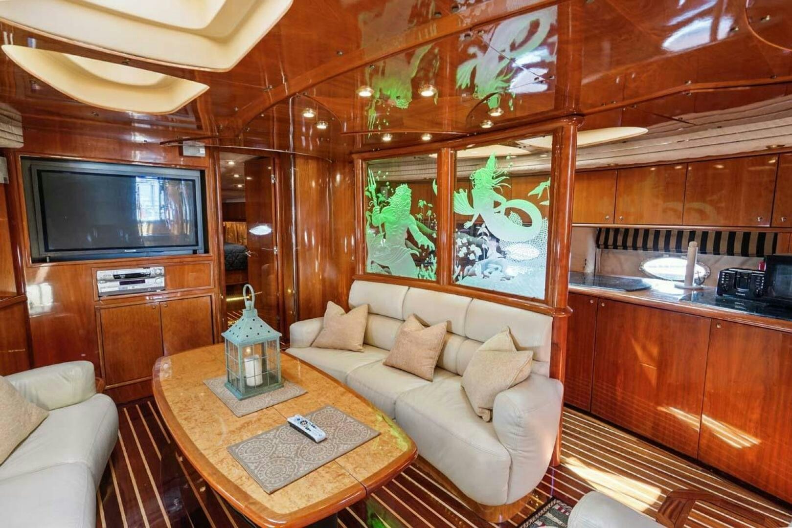 a living room with a wood ceiling aboard OBSESSION Yacht for Sale