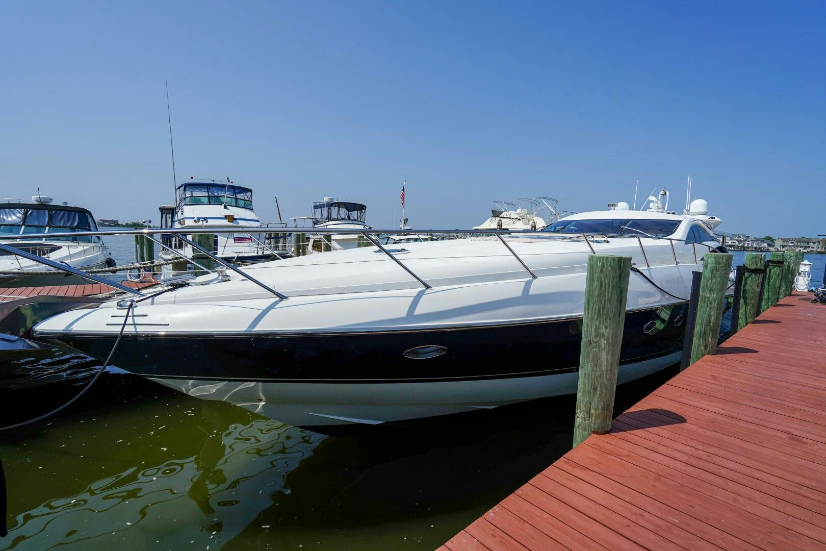 a boat docked at a pier aboard OBSESSION Yacht for Sale