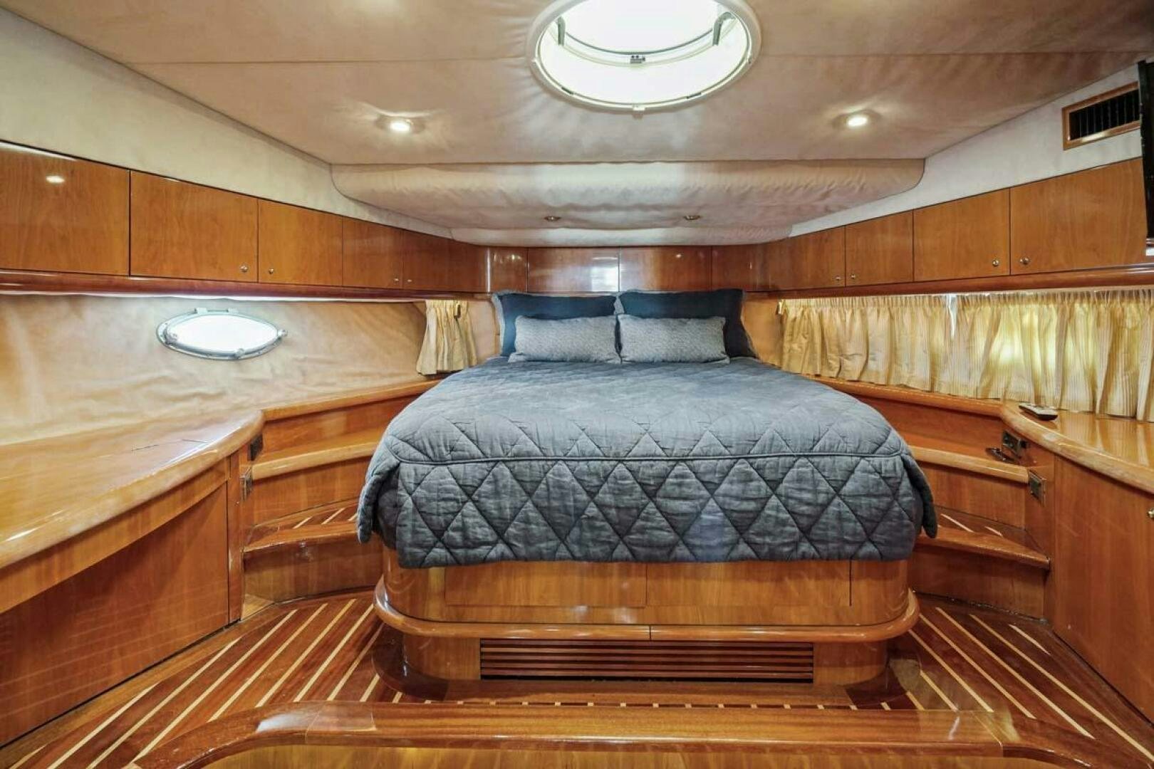 a bed in a room aboard OBSESSION Yacht for Sale