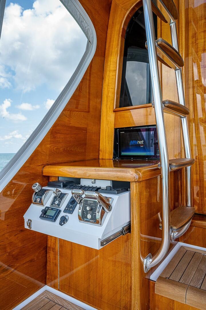 a device on a table aboard MAXIMUS Yacht for Sale