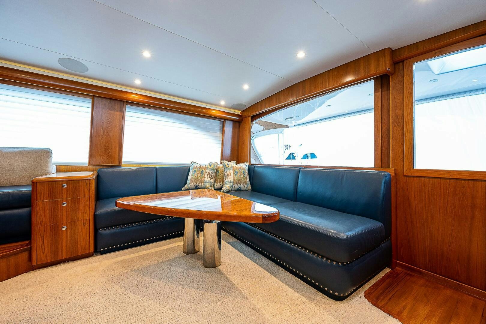 a living room with a leather couch aboard MAXIMUS Yacht for Sale