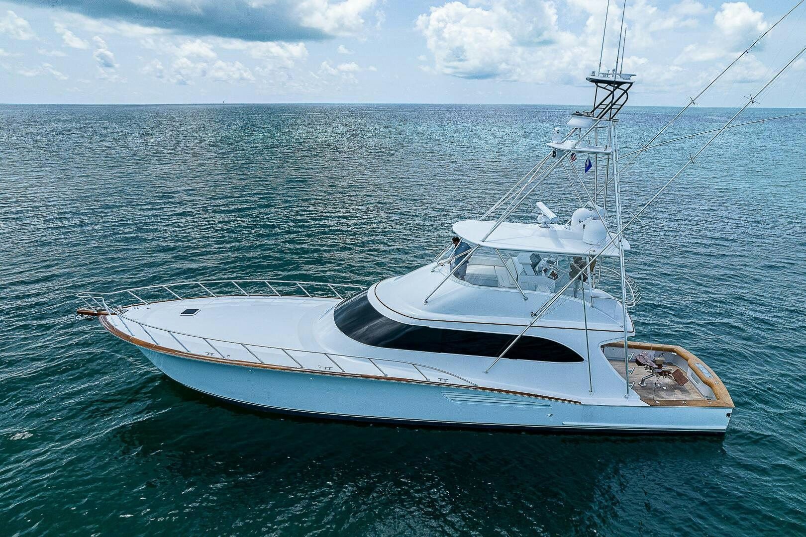 a white boat in the water aboard MAXIMUS Yacht for Sale