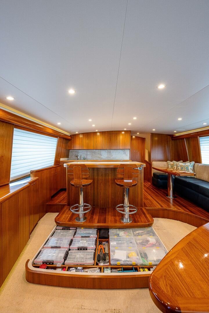 a living room with a table and chairs aboard MAXIMUS Yacht for Sale