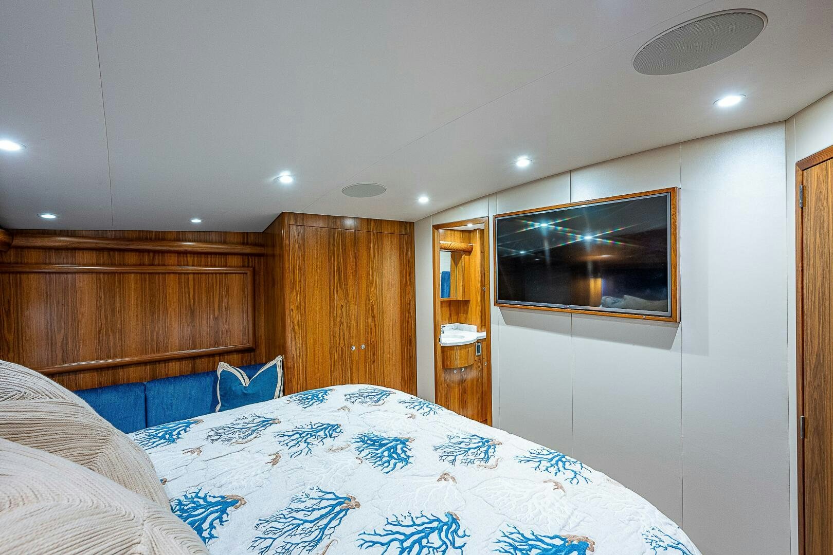 a bedroom with a bed and a television aboard MAXIMUS Yacht for Sale