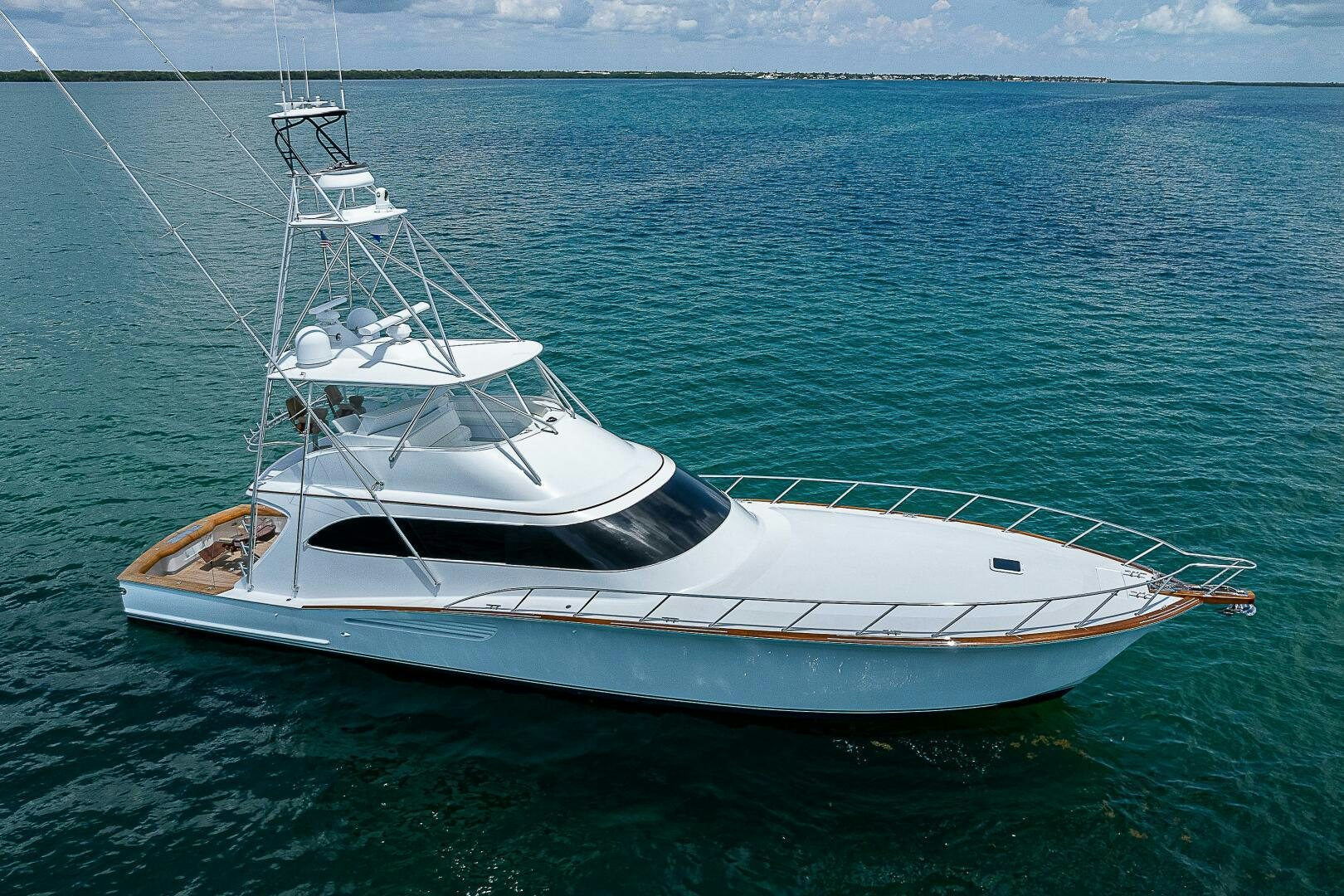 a white boat in the water aboard MAXIMUS Yacht for Sale