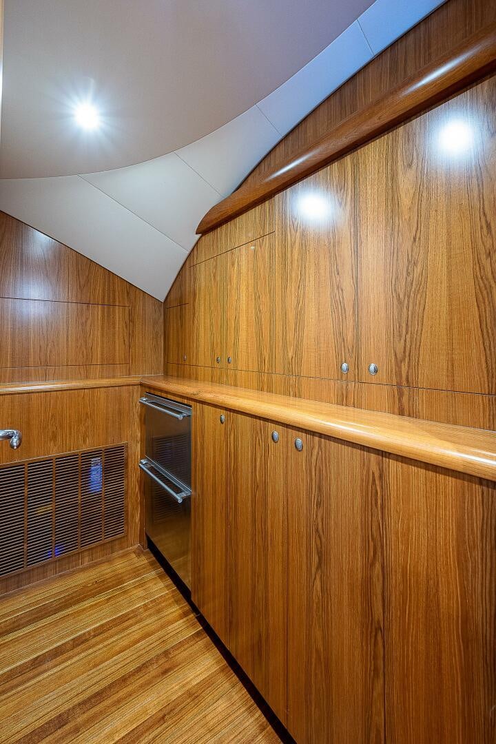 a wooden room with wooden cabinets aboard MAXIMUS Yacht for Sale