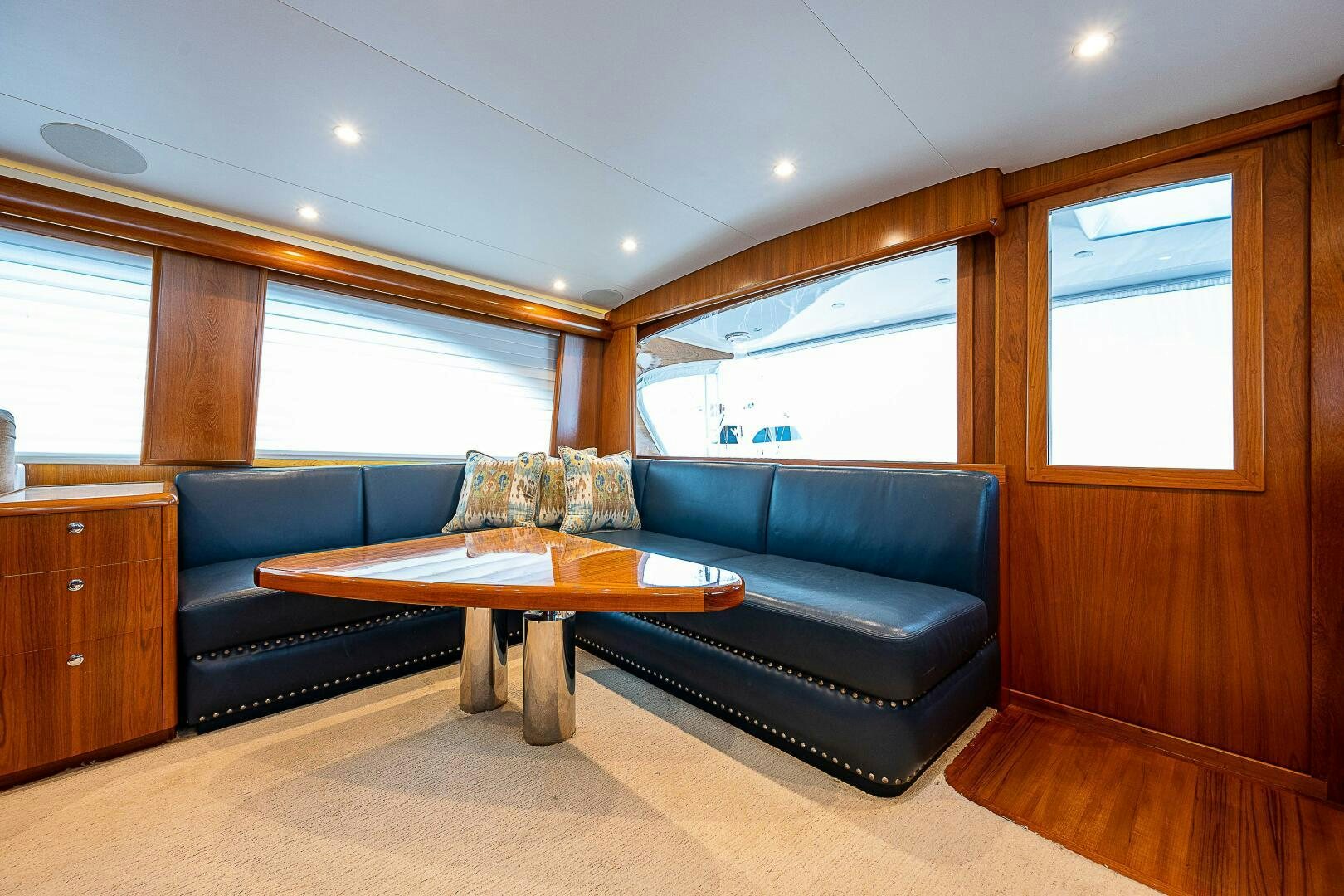a living room with a couch and a coffee table aboard MAXIMUS Yacht for Sale