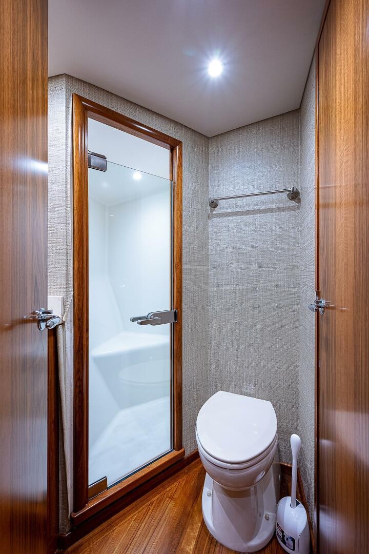 a bathroom with a toilet and a shower aboard MAXIMUS Yacht for Sale