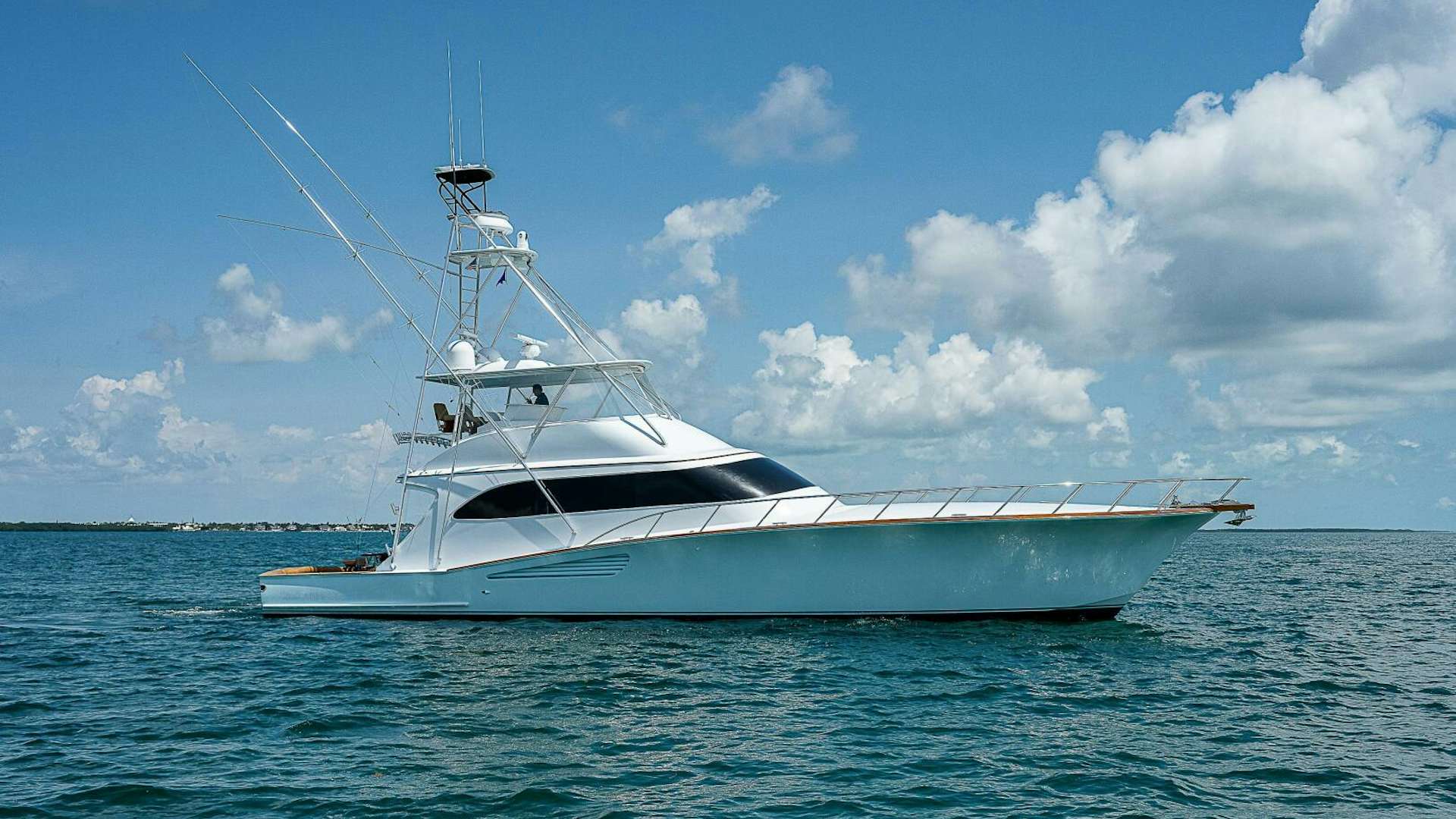 a white boat in the water aboard MAXIMUS Yacht for Sale
