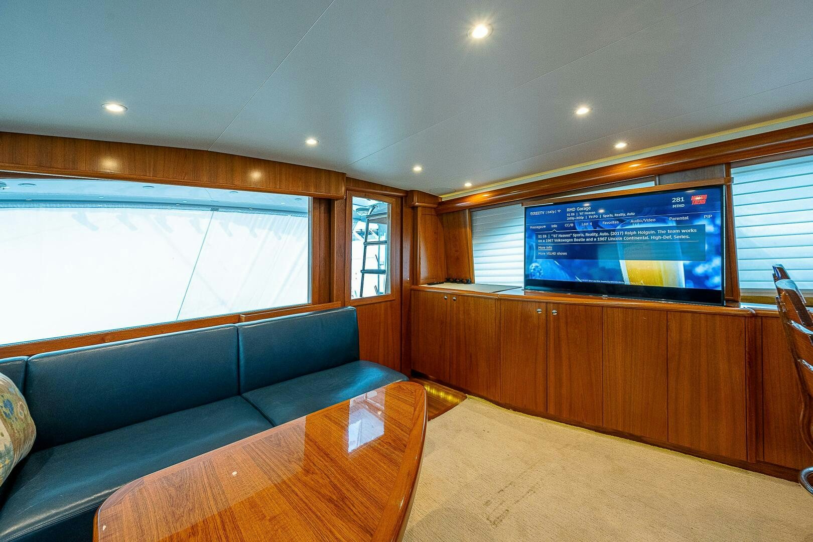 a living room with a large screen aboard MAXIMUS Yacht for Sale