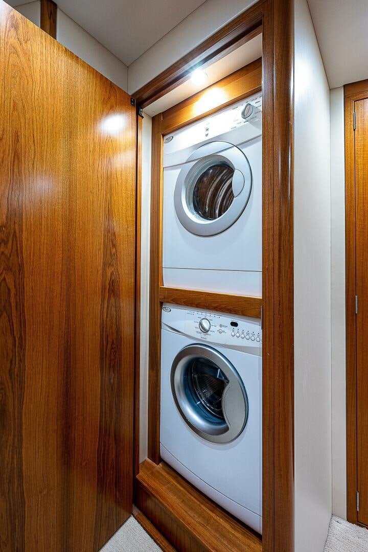 a white washing machine aboard MAXIMUS Yacht for Sale