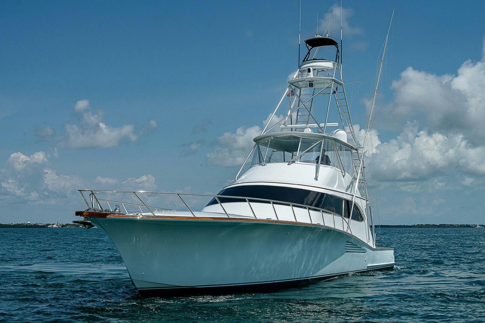 a white boat on the water aboard MAXIMUS Yacht for Sale