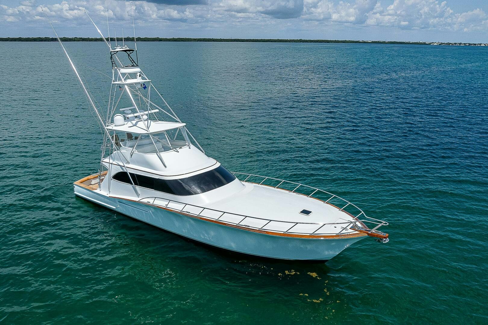 a white boat in the water aboard MAXIMUS Yacht for Sale